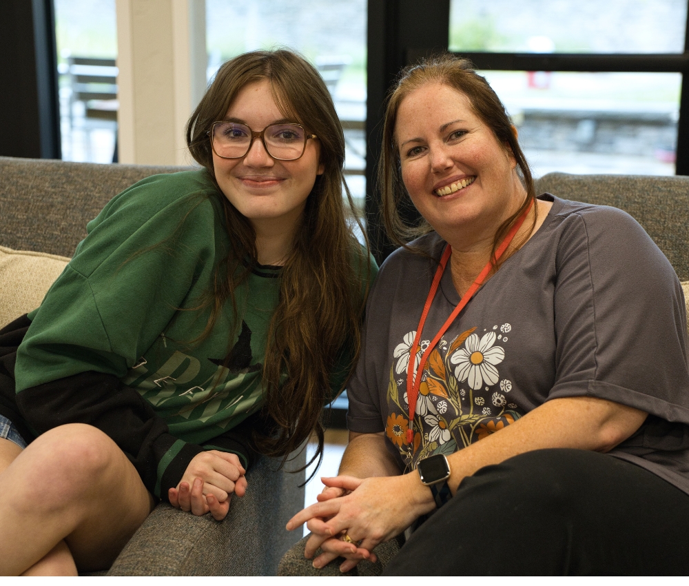 Mom and daughter on the couch at the House.