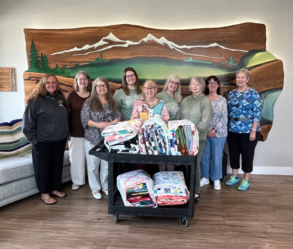 Volunteers with their handmade blankets.