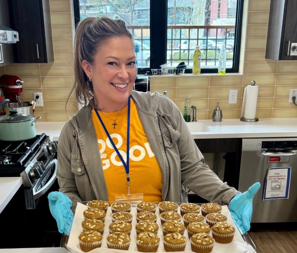 Volunteer baking cookies at the House.