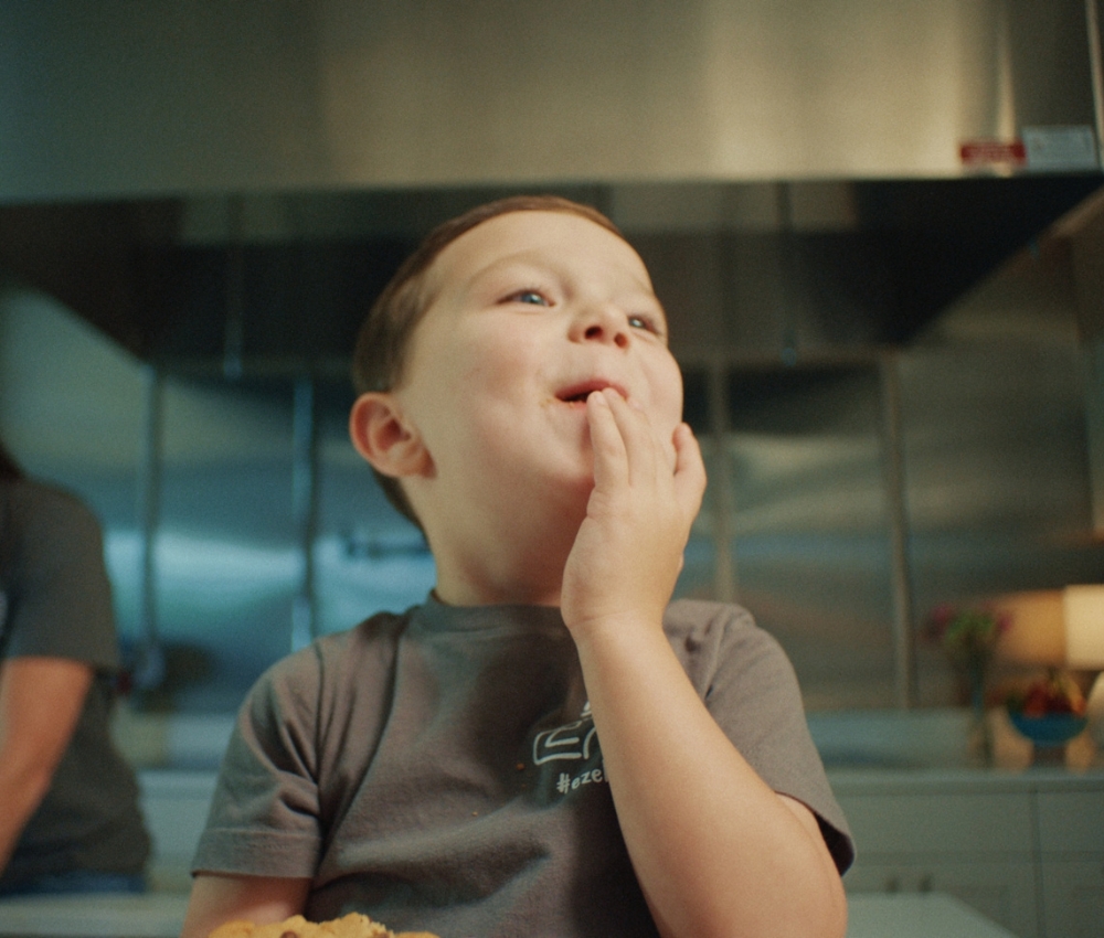 Little boy in a kitchen.