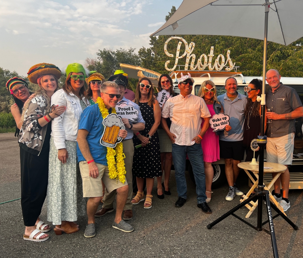 Group at a photobooth at Sippin' at Sunset.