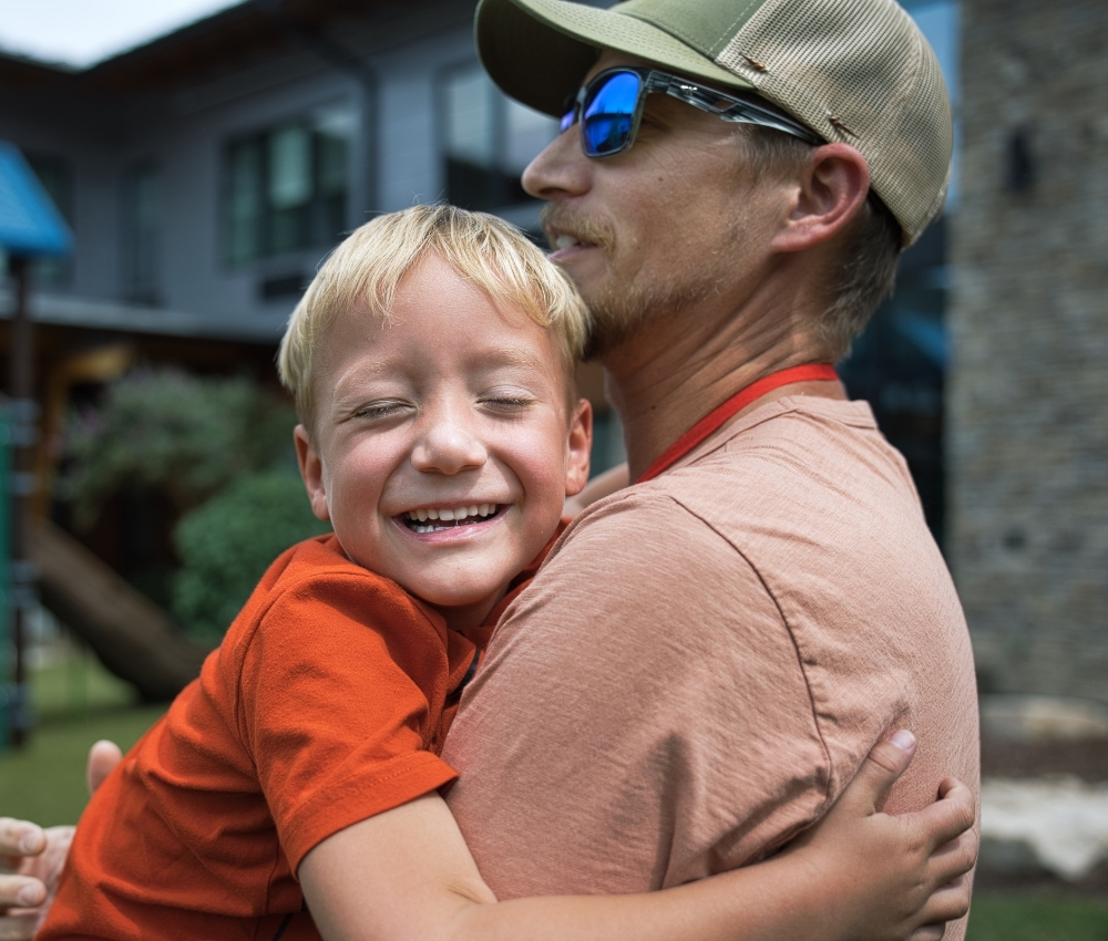 Father and son hugging.