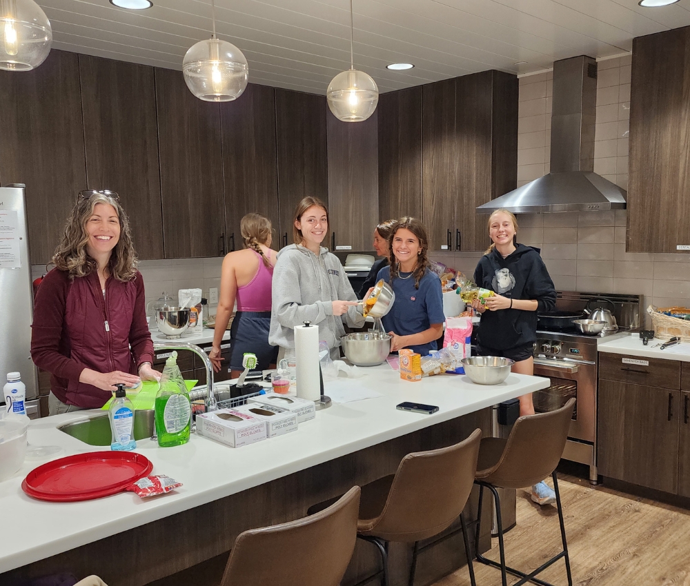 Group cooking dinner in the Family Room.